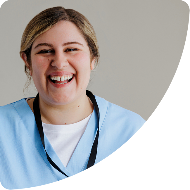 smiling woman in scrubs