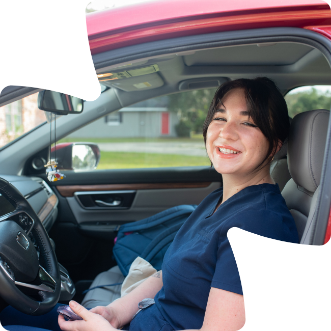 smiling woman in car